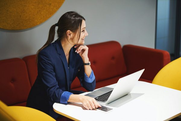 woman on laptop in office space